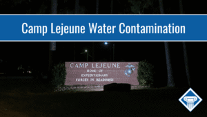 Photo of the entrance to Camp Lejeune at nighttime. Article title is across the top: Camp Lejeune Water Contamination