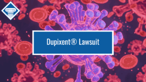 Image of a white blood cell surrounded by red blood cells with the Woods & Woods logo at the top left corner and the title of the article, "Dupixent Lawsuit" in the middle of the image in a blue box.