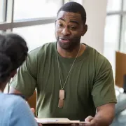 Soldier talking to a doctor.