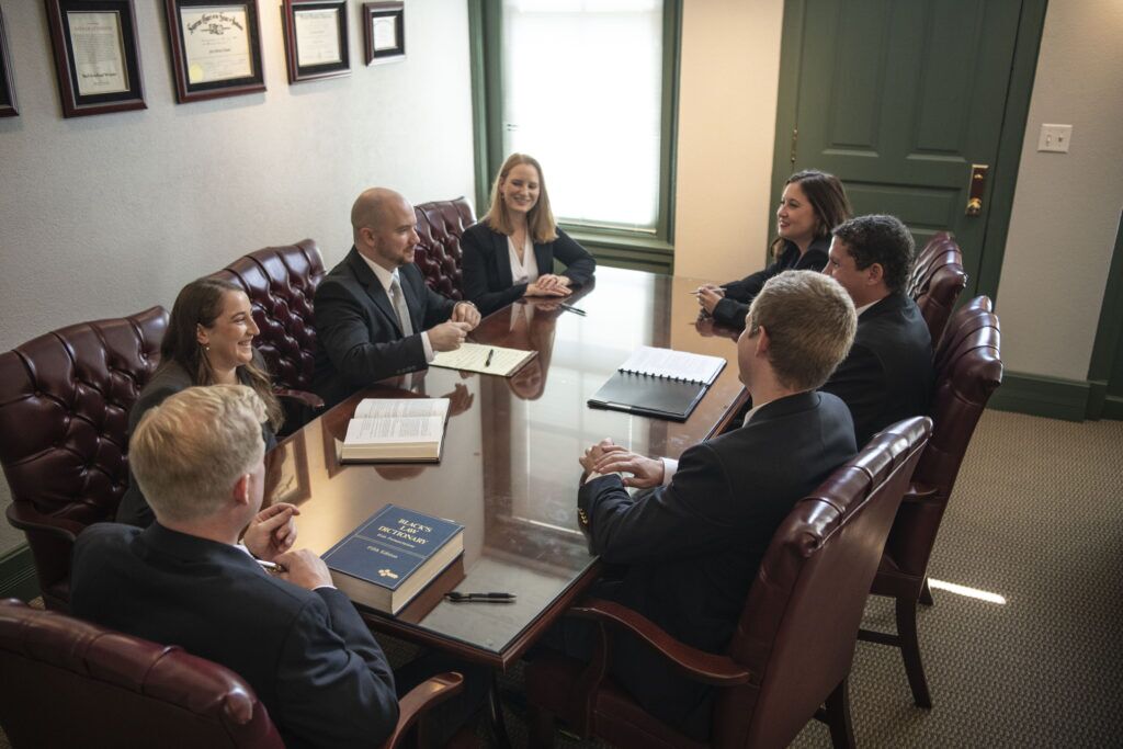 Woods & Woods Attorney Team discussing around table