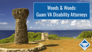 Photo of an ancient latte stone overlooking the Pacific ocean in Guam. Article title is in a blue box in the top right of the image: "Woods & Woods: Guam VA Disability Attorneys"